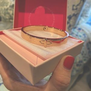 Rose gold bangle bracelet. Snap closure.
